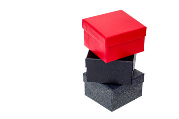 Gray box with black top and red box on top on a white background
