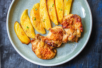 fried chicken and potatoes keto or paleo diet menu concept food background. top view. copy space for text