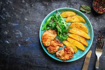 fried chicken and potatoes keto or paleo diet menu concept food background. top view. copy space for text