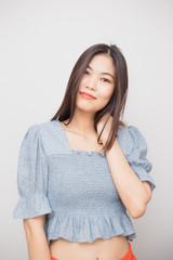 Beautiful smile asian young woman touching on hair with clean and fresh skin Happiness and cheerful with positive emotional  on white background