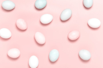 Easter pink and white eggs on a pink background, top view, flat lay, minimal style. Easter background.