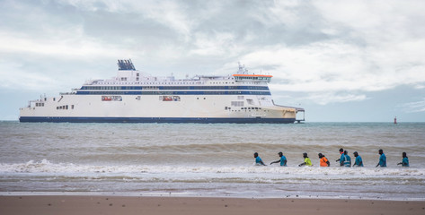 group of walkers in the water in the north of France
