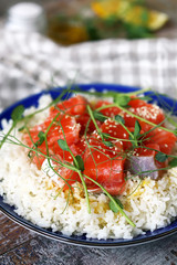 Selective focus. Poke bowl with salmon and microgreens. Healthy food.