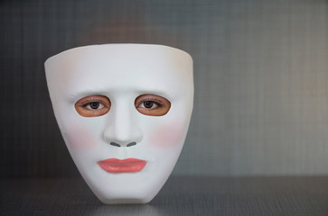 white plastic face mask with human eye,female