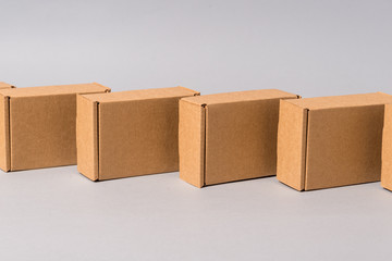 Set of brown cardboard boxes on grey background