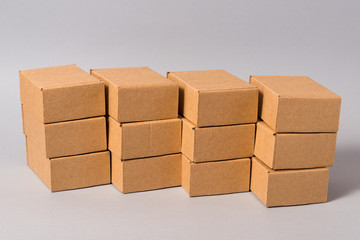 Set of brown cardboard boxes on grey background