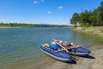 Panoramic landscape of the Kitoy river, Irkutsk region, Russia. Catamaran ready for rafting on...