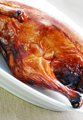 Chinese roasted duck on plate closeup