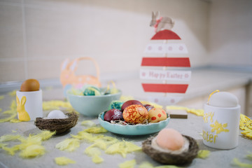 Painted eggs with Easter decoration on counter