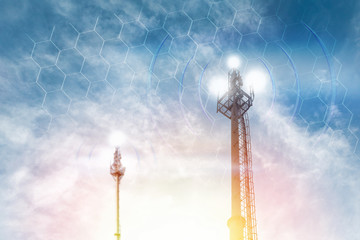 Telecommunications antenna against the clear blue sky with the image of the grid. Copy space. The...