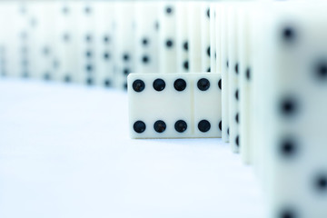 Donino chips. Maximum score chip as a accent in the domino line. Business concept idea. Close up...