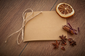Blank paper on wood table. Vintage table top with blank paper. Old brown wooden boards and blank paper. Top view of blank paper page on wood background office desk and different objects.