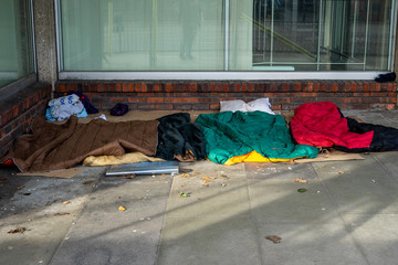 Sleeping bags on the ground laid down by rough sleepers or homeless people
