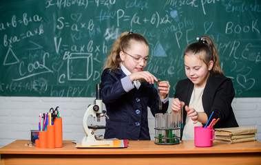 Safety measures for providing safe chemical reaction. Basic knowledge of chemistry. Make studying chemistry interesting. Pupils cute girls use test tubes with liquids. Chemistry experiment concept