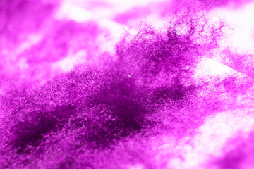 Abstract pink background with tuft of wool