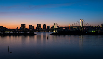 Fototapeta na wymiar Tokyo Bay and Rainbow Bridge at Sunset