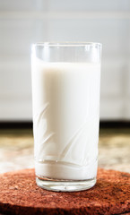 Glass of milk on a wooden stand