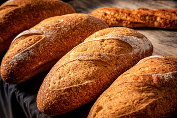 Close up of loaves of bread lit with hard studio lights