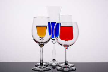 two glasses of wine on white background