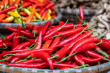 Red hot chili peppers for sale at street food market in Vietnam. Close up
