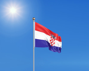 3D illustration. Colored waving flag of Croatia on sunny blue sky background.