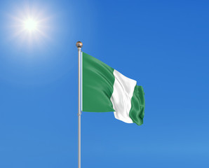 3D illustration. Colored waving flag of Nigeria on sunny blue sky background.