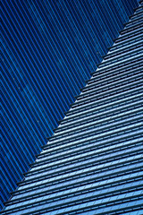 Naklejka premium High glass skyscrapers on the streets of Singapore. Office windows background, closeup