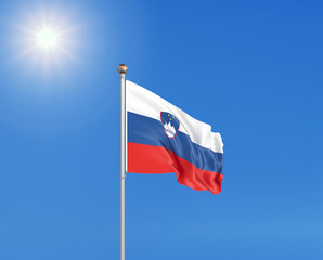 3D illustration. Colored waving flag of Slovenia on sunny blue sky background.