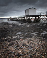 a jetty at the shore at low tide, the hardway Gosport, Hampshire
