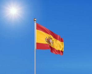 3D illustration. Colored waving flag of Spain on sunny blue sky background.