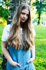 Obraz premium young pretty sensual girl with fashion makeup posing in birch tree forest, lifestyle people concept