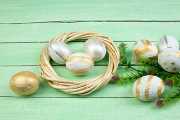 Happy Easter. eggs isolated on wooden table background.. Balls, wreath woven from the vines. Copy space for text. Top view.