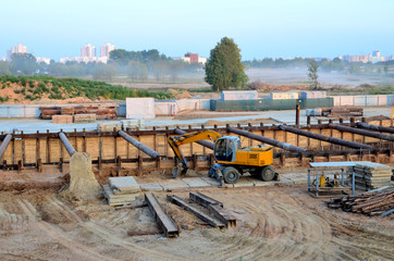 Excavator working at construction of a new metro line. Contractor digding the tunnel subway and...