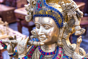Obraz premium Figure of the God Krishna playing the flute.