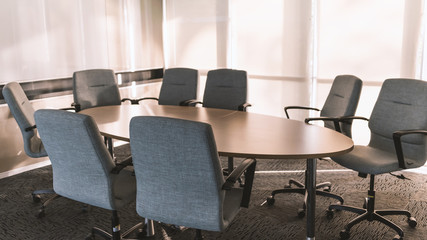 Meetting room with nobody and modern furniture in morning sunlight from outside