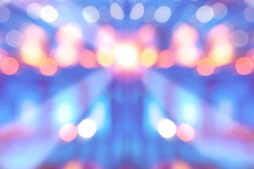 Fotobehang abstract multi-colored light background with defocused bokeh light, the stage of the entertainment show © thanasak
