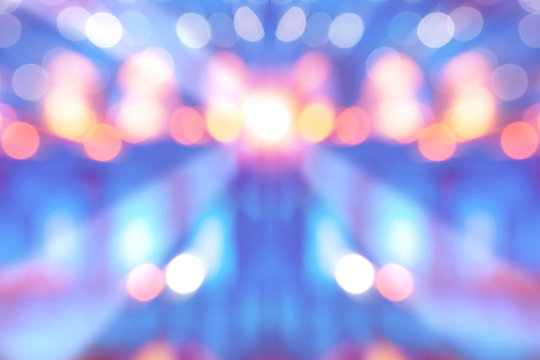 abstract multi-colored light background with defocused bokeh light, the stage of the entertainment show