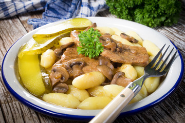 Braised pork loin with mushrooms.