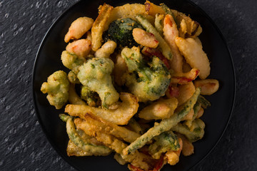 Japanese vegetable tempura on black background.Top view