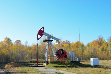 Oil drilling derricks at desert oilfield for fossil fuels output and crude oil production from the...