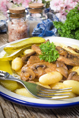 Braised pork loin with mushrooms.