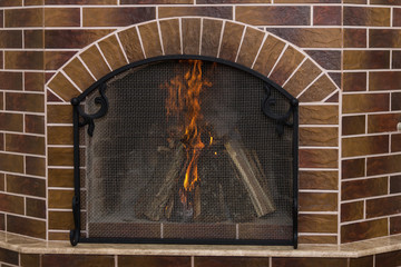 Burning fireplace. Fireplace as a piece of furniture
