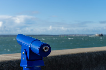 A pay per view telescope looking out to a view of the sea