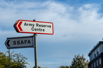 an army reserven centre sign and a SSAFA sign on a lamp post