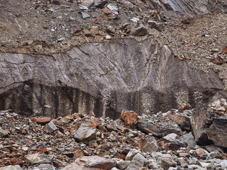 Close up of dark melting glacier in Caucasus mountains