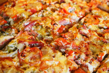 Obraz na płótnie Canvas Fresh homemade sliced pizza. Close-up. Top view. Background. Texture.
