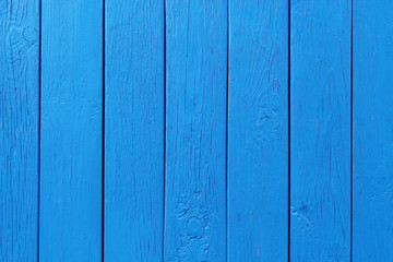 Wooden boards painted blue. Close-up. Vertical view. Background. Texture.