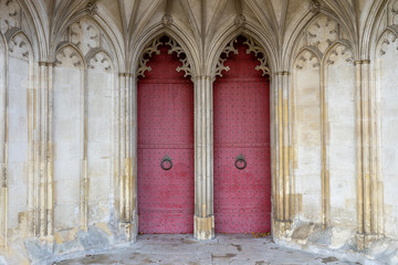 Fototapeta na wymiar The entrance or main doors to an old English cathedral designed in the Gothic style