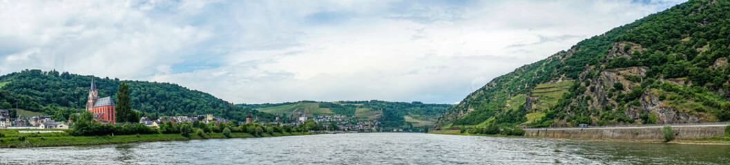 Obraz na płótnie Canvas Germany, Rhine Romantic Cruise, a large body of water with a mountain in the background panorama