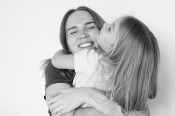 mother and daughter hug each. black-white. 